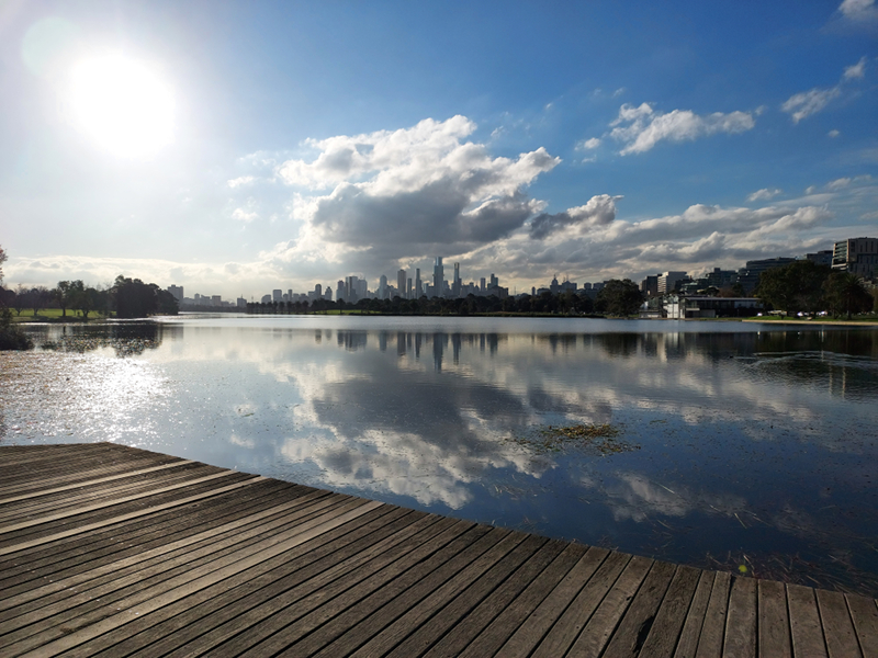 City reflected in lake.